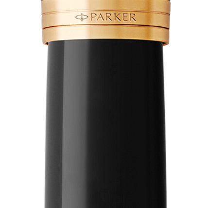 Closeup of a Parker 51 pen barrel and pen cap with gold trim showcasing an engraved Parker logo.
