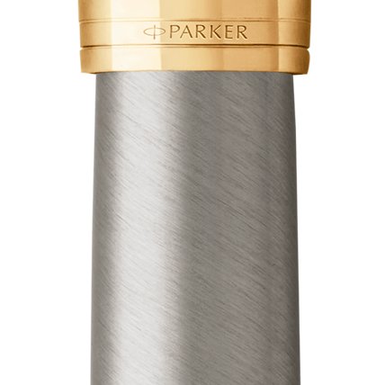 Closeup of a Parker 51 pen barrel and pen cap with gold trim showcasing an engraved Parker logo.