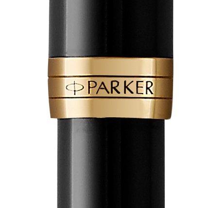 Closeup of a Sonnet barrel and pen cap with gold trim showcasing an engraved Parker logo.