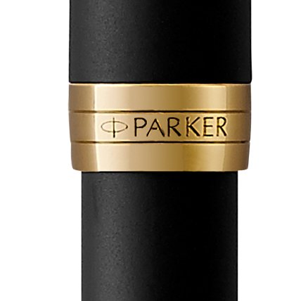 Closeup of a Sonnet barrel and pen cap with gold trim showcasing an engraved Parker logo.