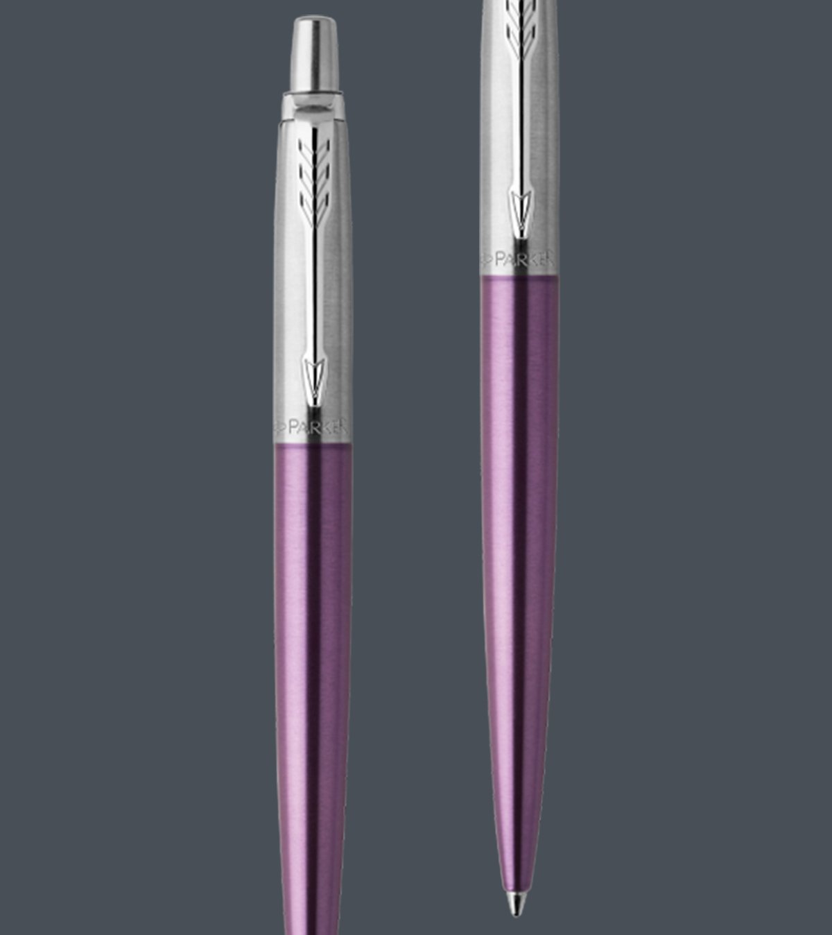 Two upright Jotter ballpoint pens with chrome trim.