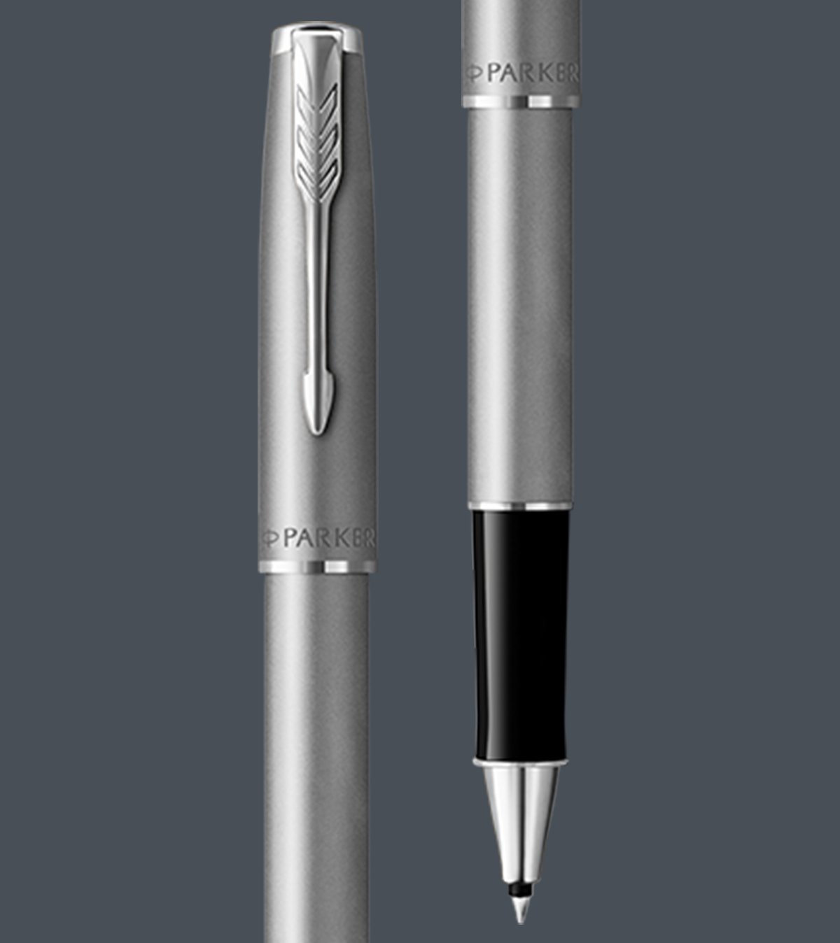 Two upright Sonnet Rollerball Kalems with chrome trim.